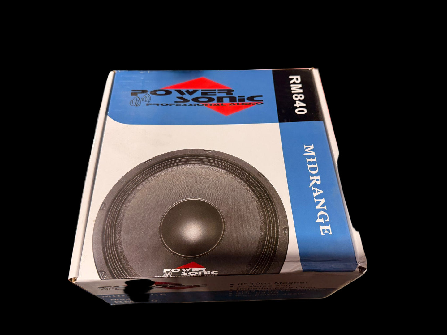 Power Sonic midrange speaker box on a cluttered surface